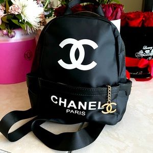 CHANEL Black Nylon Backpack with White CC Logo and Gold Charm